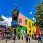 Colorful buildings along Caminito in Buenos Aires, capturing the vibrant neighborhood life experienced by Americans living in Argentina.